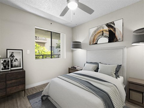 a bedroom with a bed and a ceiling fan at Harbor Terrace Apartments, San Pedro ,California, 90731