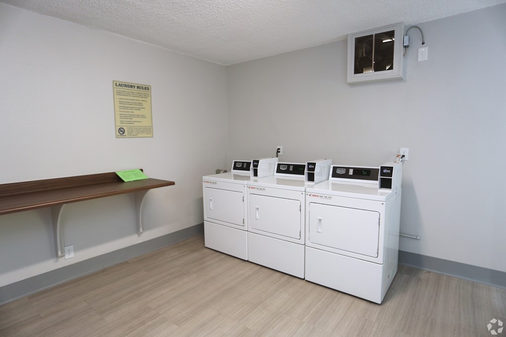 A laundry room with a washer and dryer.