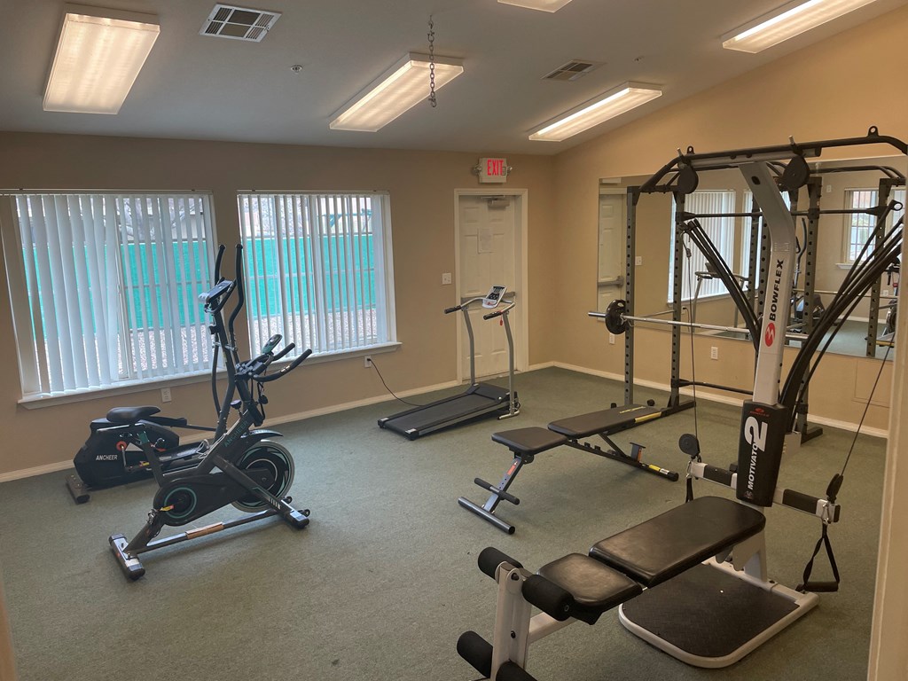 a fitness room with exercise equipment