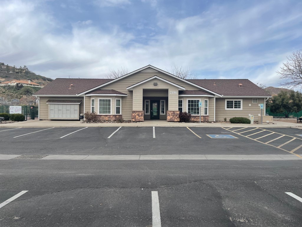 a house with a parking lot in front of it