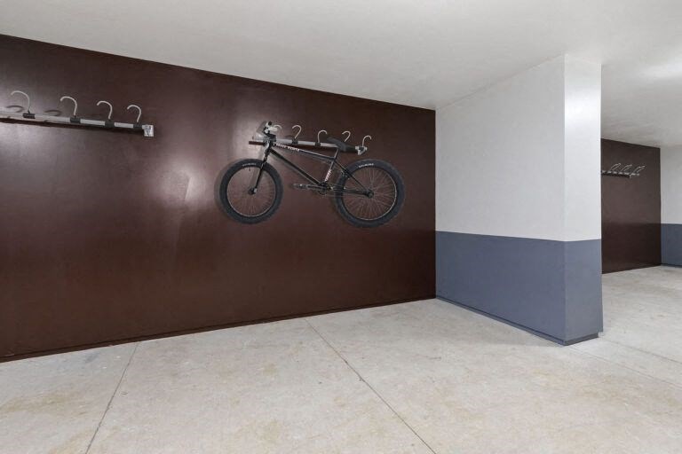 a bike hanging on a wall in a room