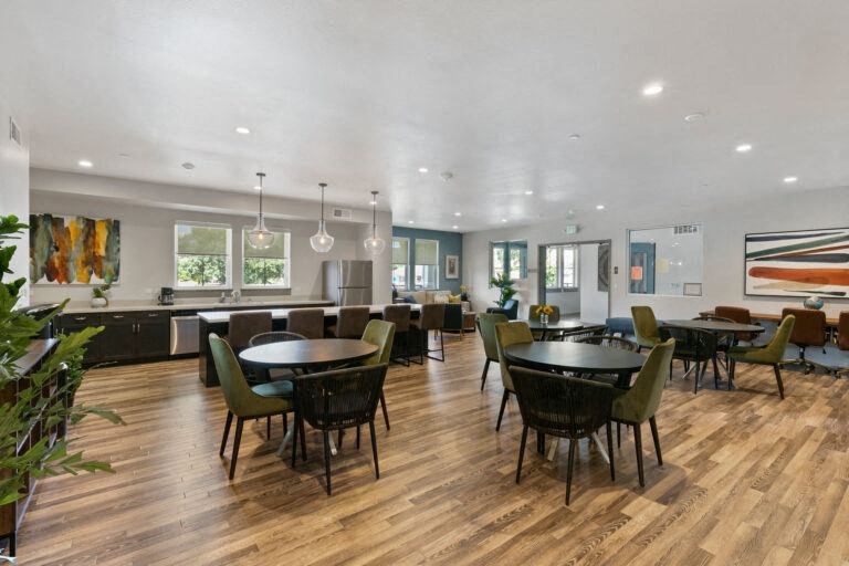 a large dining room with tables and chairs
