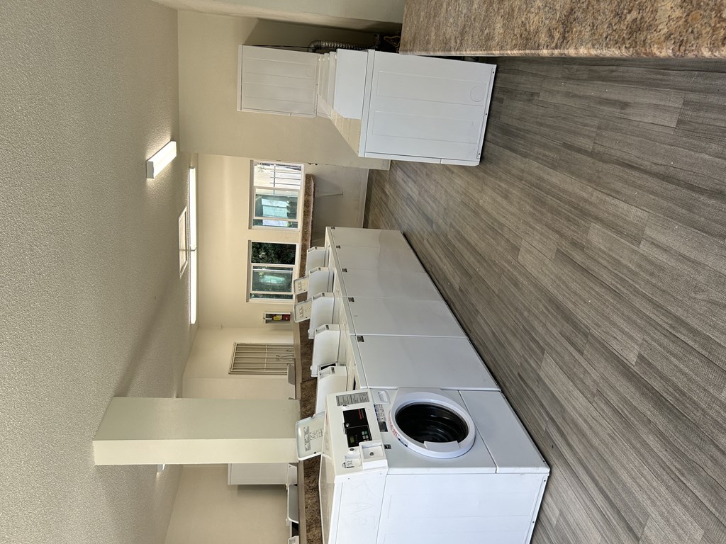 an overhead view of a laundry room with a washer and dryer