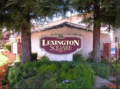 the sign in front of the lexington square apartments