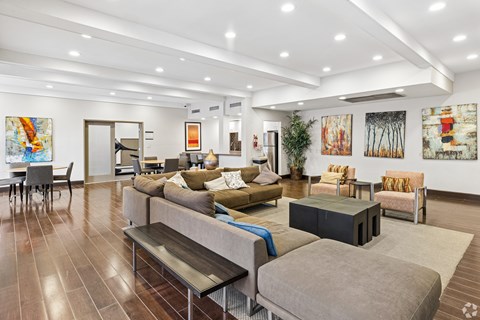 A living room with a grey couch and a coffee table.