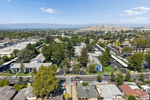 A view of a residential area with houses and trees.