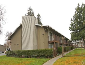 A building with a brown facade and a grey roof.