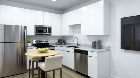 A modern kitchen with a table and chairs.