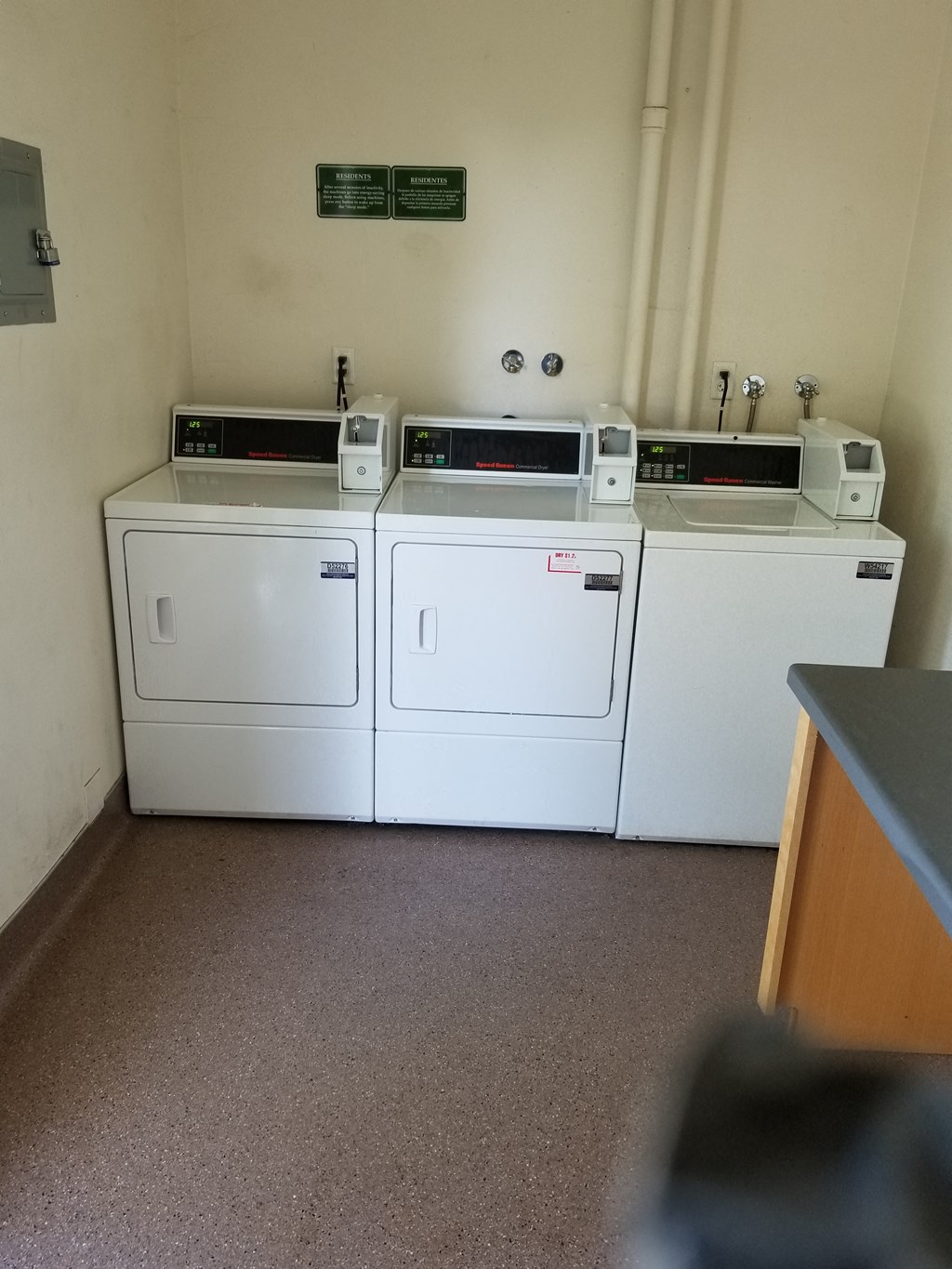 washers and dryers in a laundry room