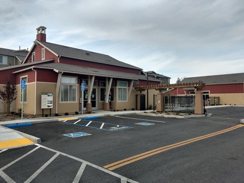 a building with a parking lot in front of it