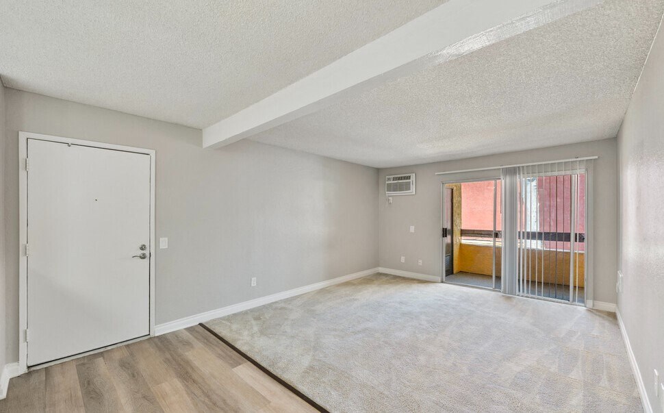 the spacious living room with sliding glass doors to the balcony at Brookhollow Apartments, California, 91792
