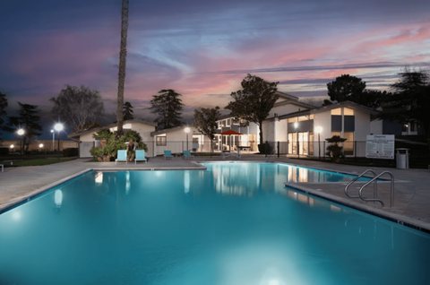 A swimming pool at a residential area during twilight at Chaparral Apartments , California