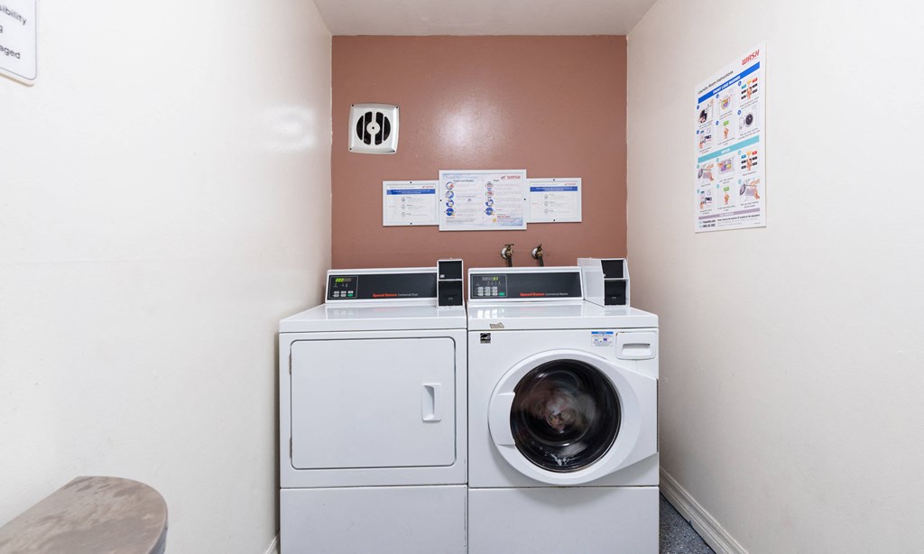 a laundry room with a washing machine and a dryer