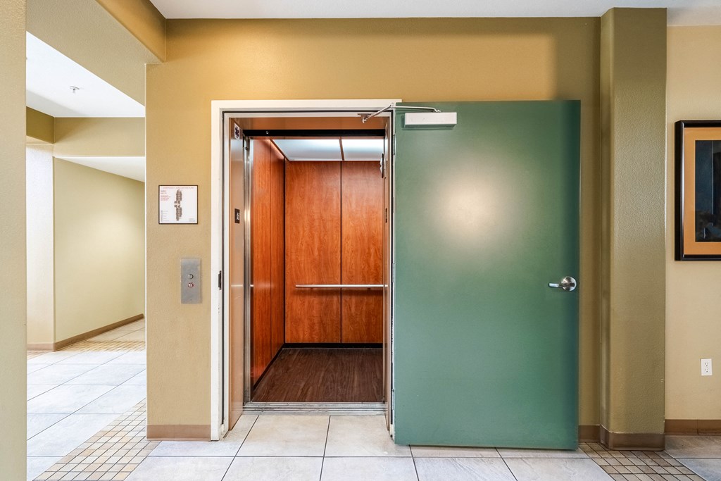 an elevator with a green door