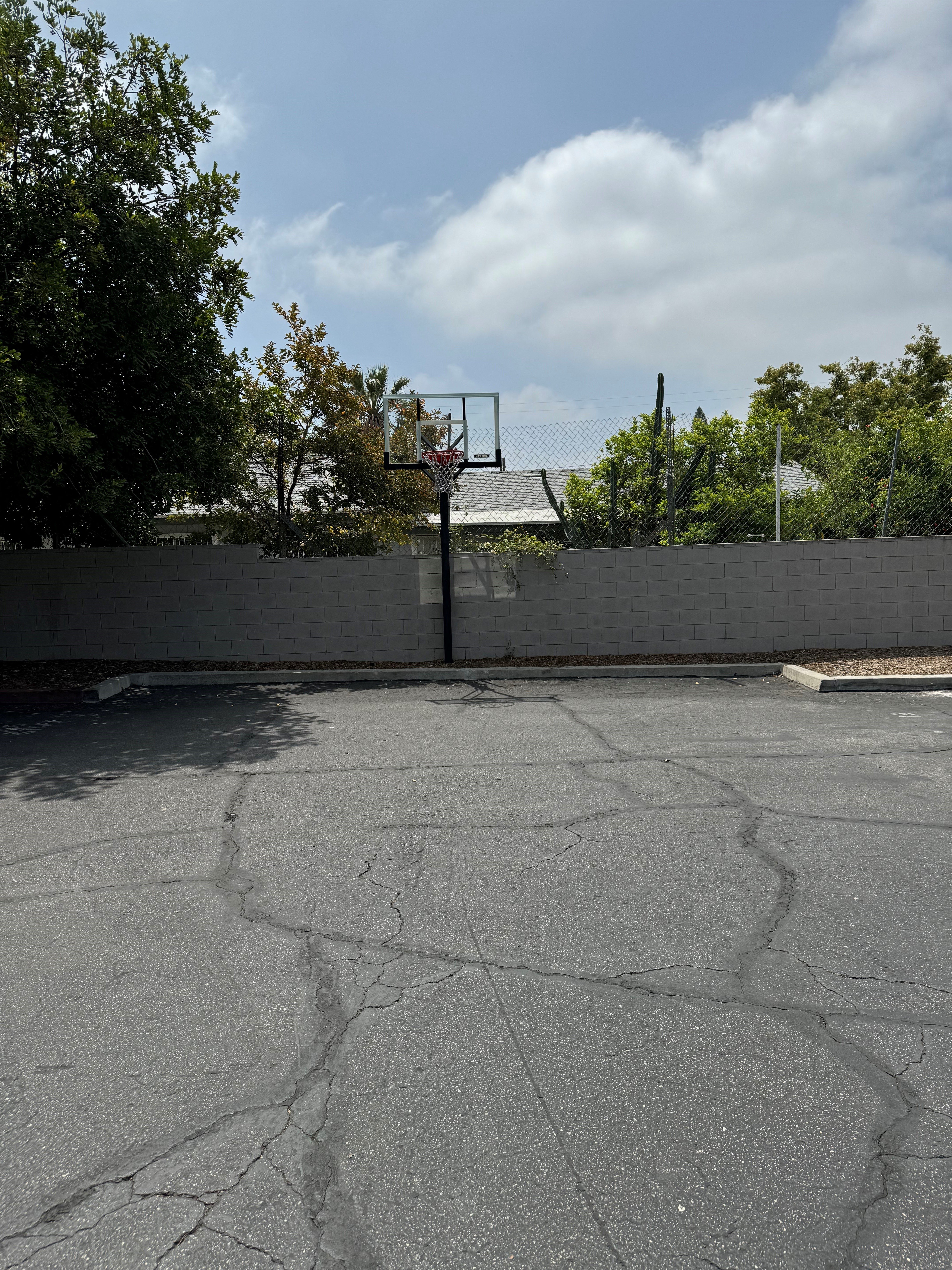 a basketball court next to a wall