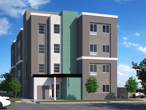 A modern building with a green and grey facade and the number 2245 on the side.