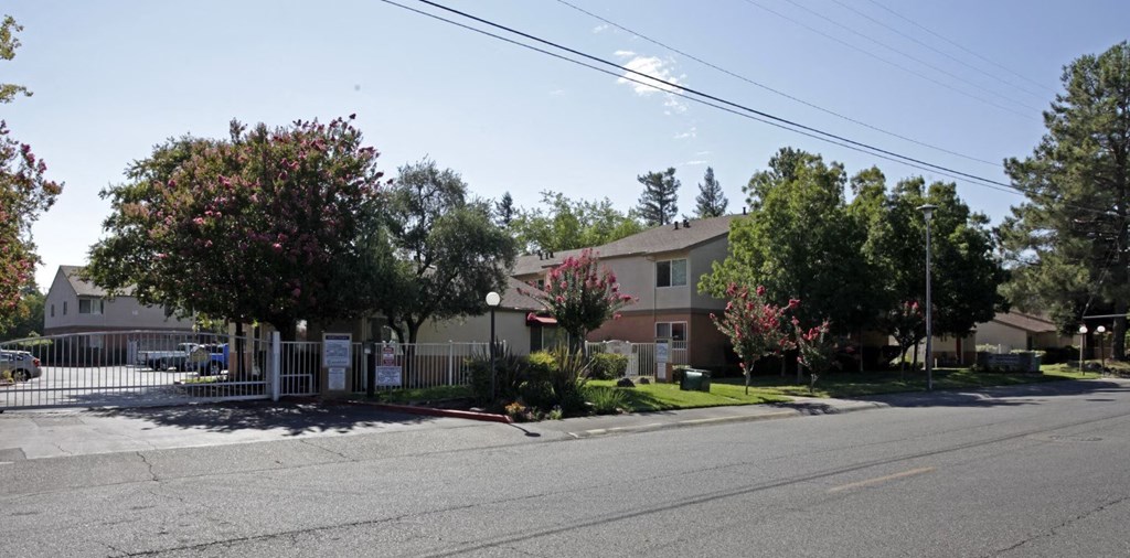 an apartment building on the corner of a street