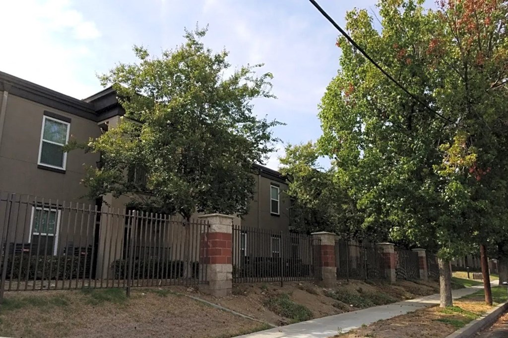 a building with a fence in front of it