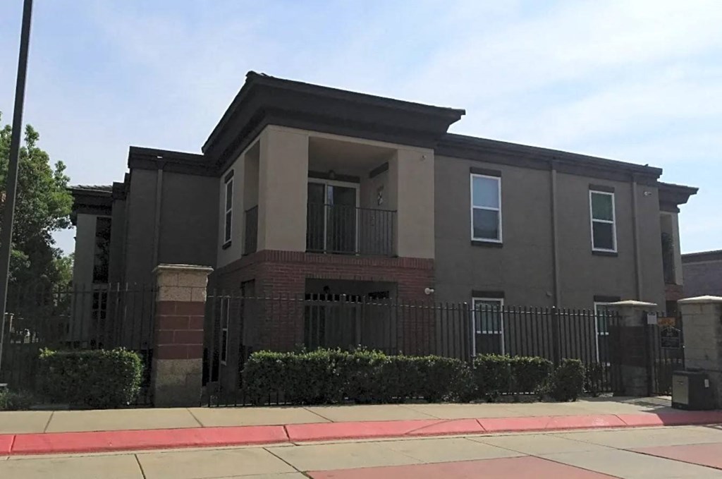 a building with a fence in front of it