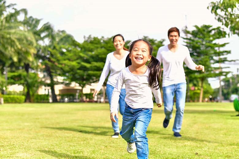 Three people running in the park