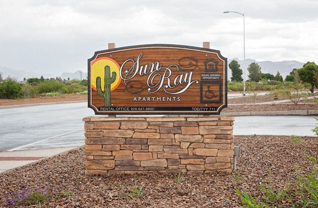 a sign that is in the middle of a field