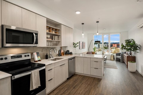 a kitchen and living room in an apartment