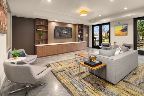 a living room with couches and chairs and a table