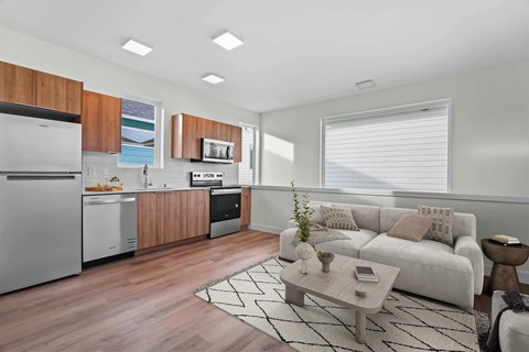 A modern kitchen with wooden cabinets and stainless steel appliances.