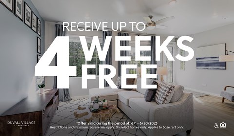 A room with a couch and a framed picture on the wall with text offering 4 weeks free.