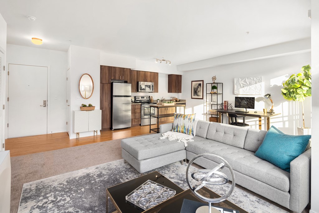 a living room with a gray couch and a coffee table