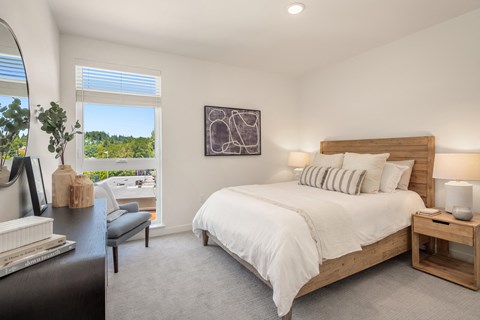 a bedroom with a large bed and a window