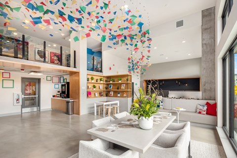 a dining room with a table and chairs