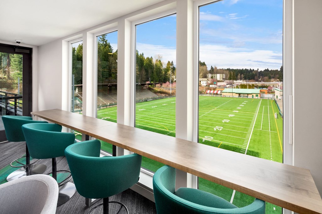 a conference room with a view of a football field