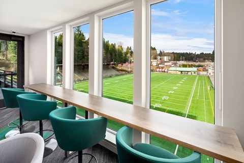 a conference room with a view of a football field