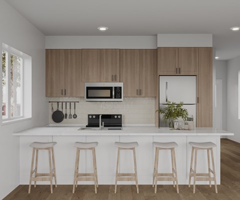 A kitchen with white countertops and wooden bar stools.