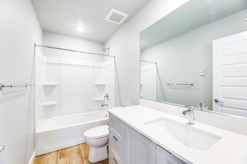 a bathroom with a bathtub and a sink