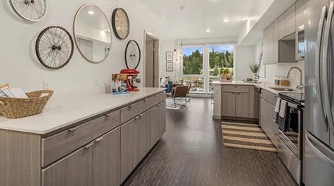 a kitchen with stainless steel appliances and counter tops