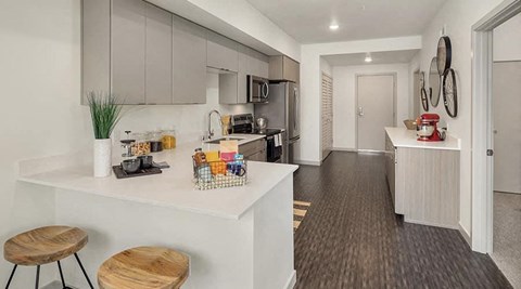 a kitchen with a counter top and a refrigerator