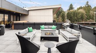 a patio with couches and a coffee table