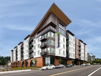 a rendering of a new apartment building on a city street