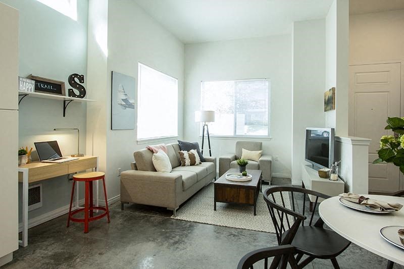 a living room with a couch and a table