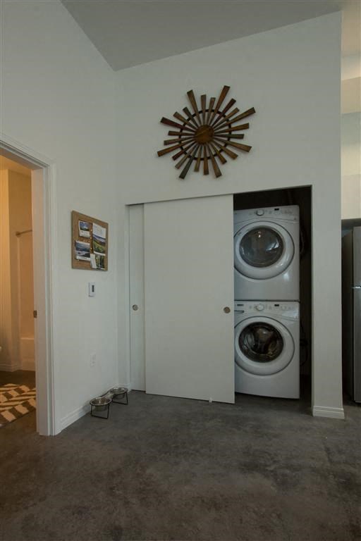 a washing machine in a room with a door