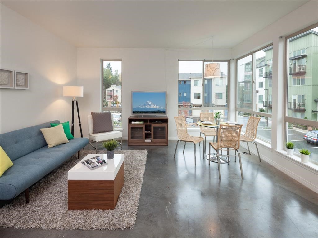 a living room with a couch and a table and a television