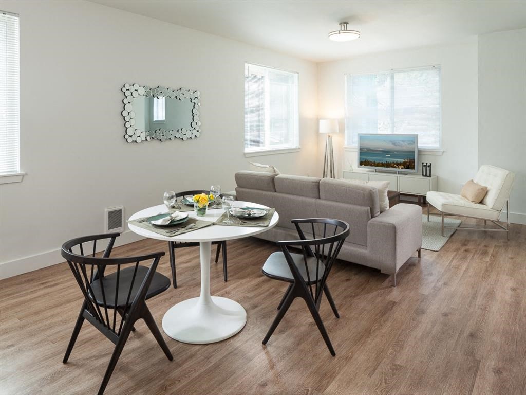 a living room with a table and a couch