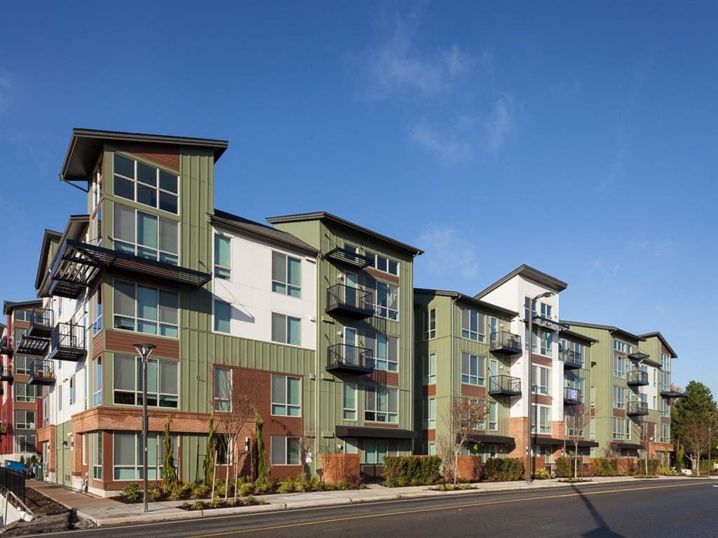 a row of new apartment buildings on a city street