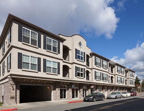 a building on the side of a street with cars