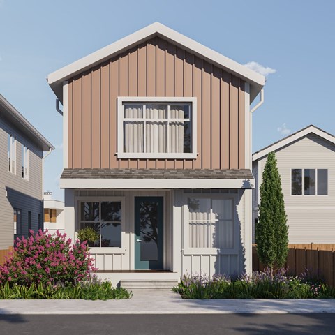 A modern house with a brown and white exterior and a white window.