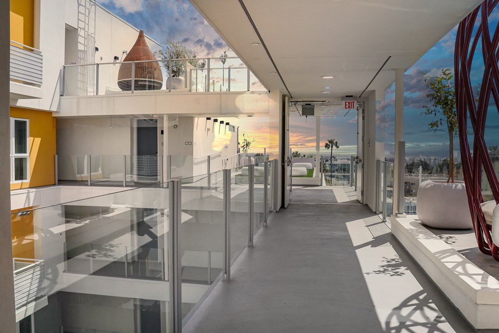 a view of a building with a mural on the wall