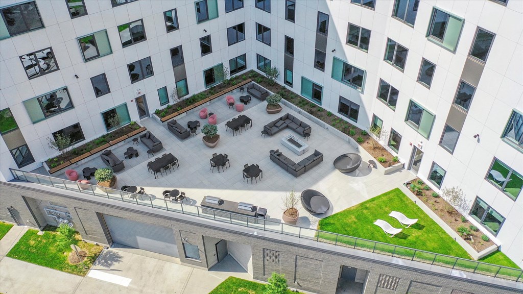 an aerial view of an office building with patio furniture at Inspire West Town, CHICAGO, 60642