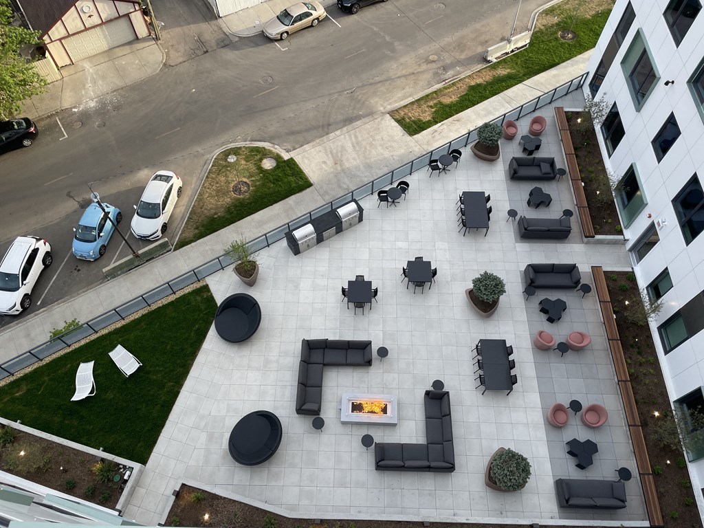 an aerial view of a courtyard with tables and chairs  at Inspire West Town, CHICAGO, Illinois